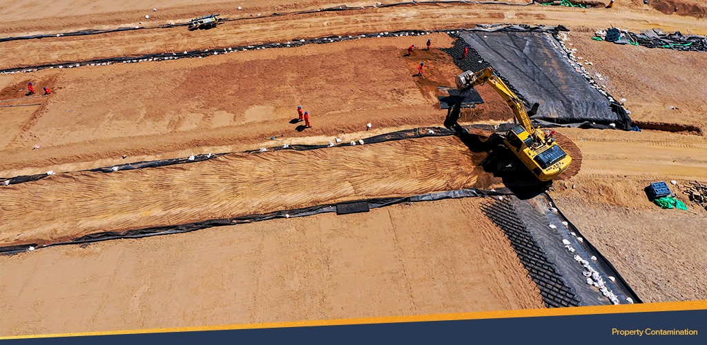 Bulldozer on land, Property Contamination.