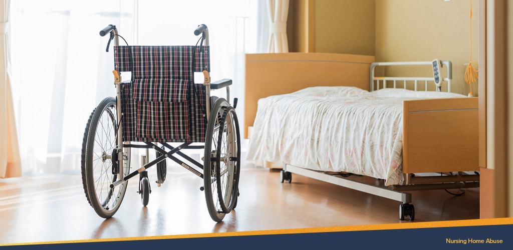 Photo of wheelchair next to a hospital bed in a nursing home, Nursing Home Abuse